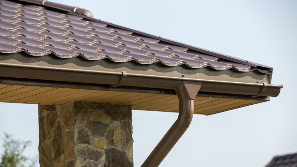 Close-up of commercial rain gutters installed on a modern building for effective rainwater management