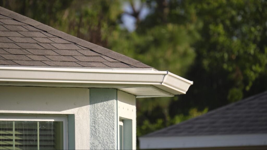 Rain gutters installed along a Florida home roof to protect the structure from heavy rain and water damage